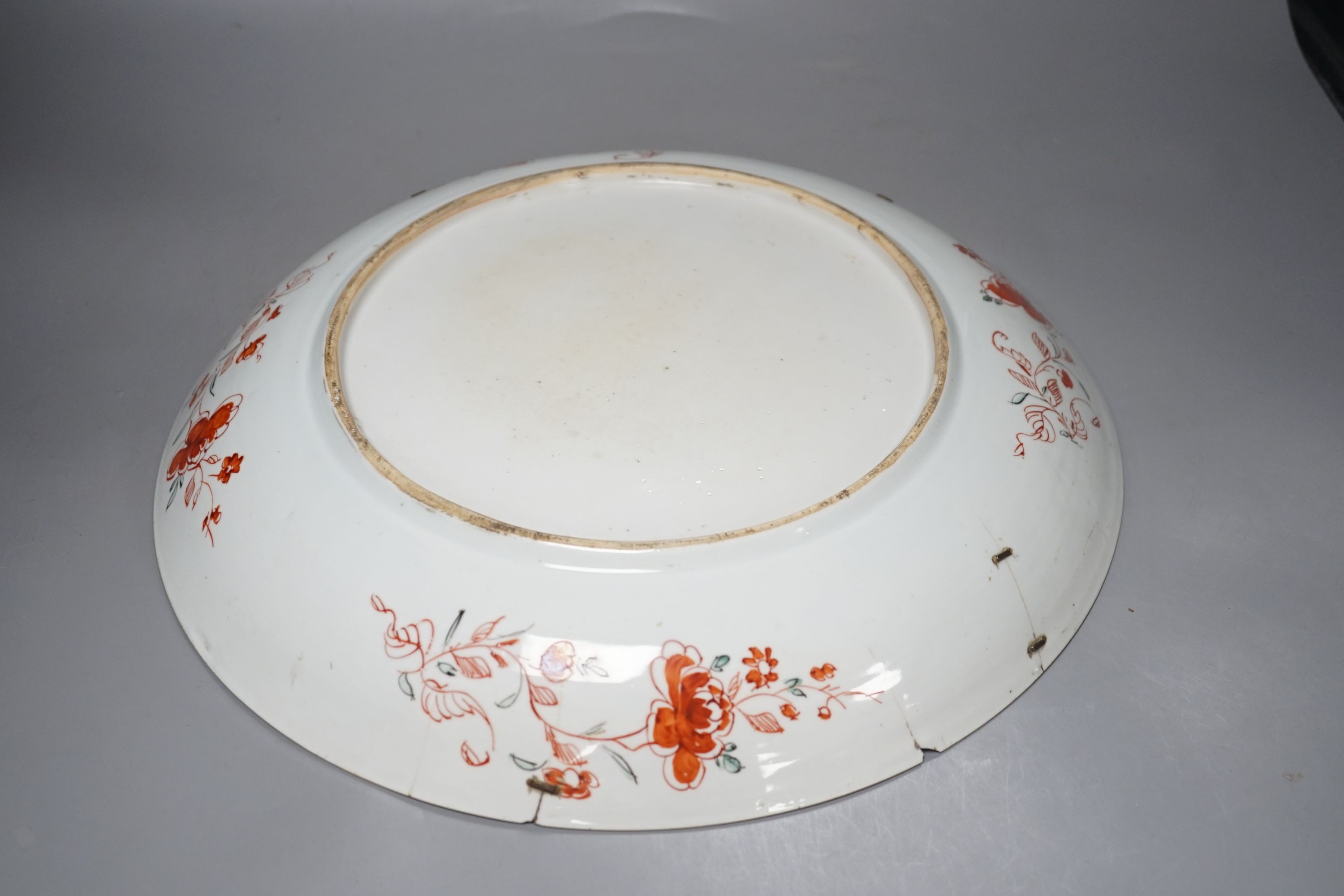 A large Chinese Kangxi dish, clobbered decoration, 37 cms diameter.